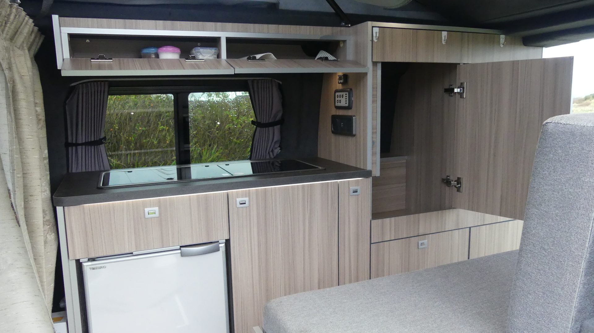 Kitchen area with adjacent cupboards